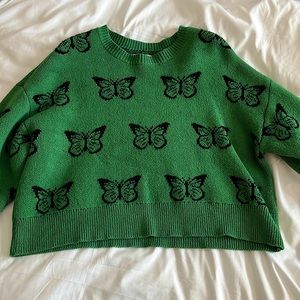 Dark green sweater black butterflies